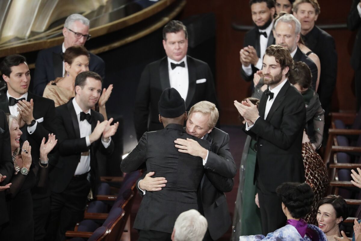 Mahershala Ali, center-left, and Viggo Mortensen celebrate the best picture win for "Green Book" during the telecast of the 91st Academy Awards on Sunday.