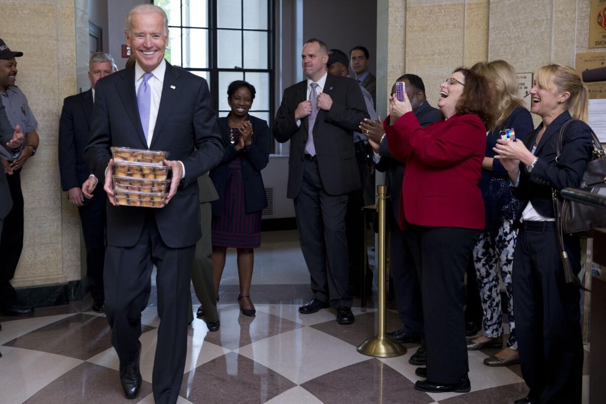 Vice President Joe Biden is bearing muffins as he welcomes furloughed Environmental Protection Agency workers back to work.