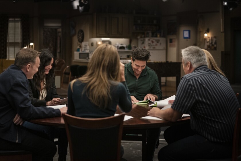 The cast of "friends" Reading scripts at a table