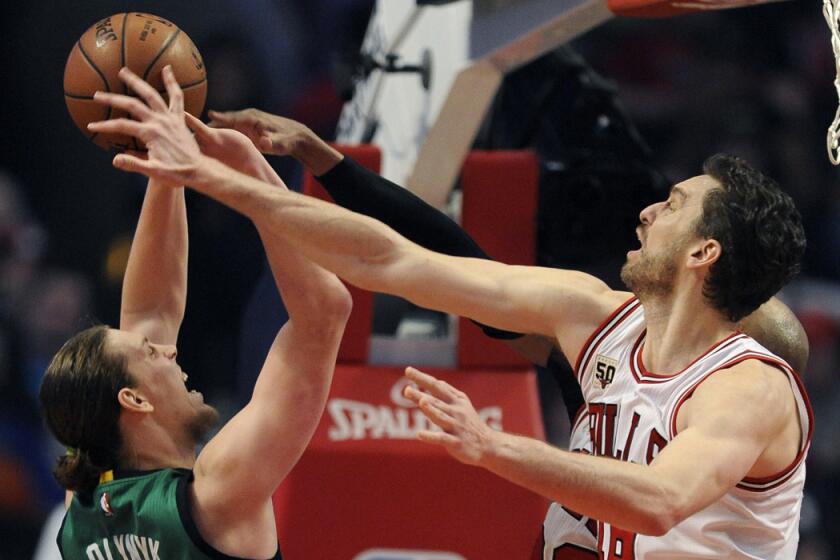 Bulls center Pau Gasol blocks a shot by Celtics center Kelly Olynyk during a game Jan. 7.