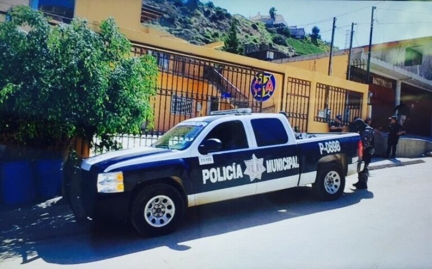 A house in Tijuana's Colonia Azteca was one of eight suspected safe houses that law enforcement authorities said were used by members of a criminal group that smuggled Central American children to the United States.