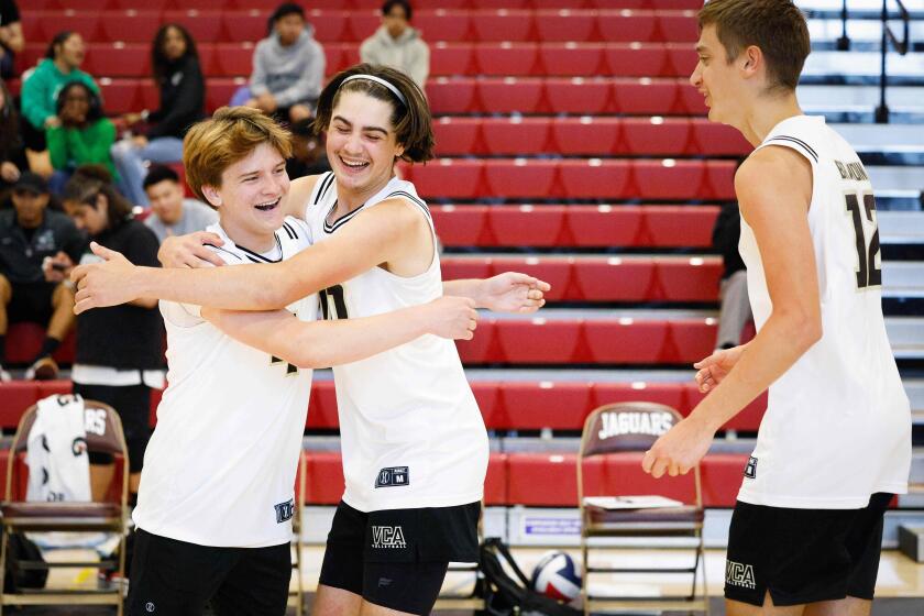 Chula Vista, CA - May 09: Victory Christian Academy's Brad Chier (4), Austin Dill (10), and Lucas Brandini (12) celebrate after beating Escondido Adventist Academy during the CIF San Diego Section Division 5 boys volleyball championship game at Southwestern College on Thursday, May 9, 2024 in Chula Vista, CA. (Meg McLaughlin / The San Diego Union-Tribune)