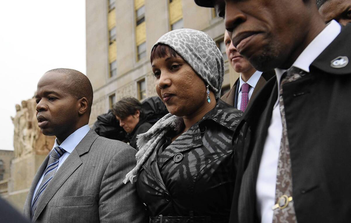 Nafissatou Diallo, the hotel maid who accused Dominique Strauss-Kahn of sexually assaulting her, leaves court in New York after settling her civil suit against him.