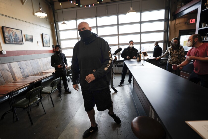 Democratic candidate for the Pennsylvania U.S.senate seat in the 2022 primary election, Lt. Gov. John Fetterman, arrives for a campaign stop at the Mechanistic Brewery, in Clarion, Pa., Saturday, Feb. 12, 2022. The Democratic Party's brand is so toxic in some parts of rural America that liberals are removing bumper stickers and refusing to acknowledge their party affiliation publicly. (AP Photo/Keith Srakocic)