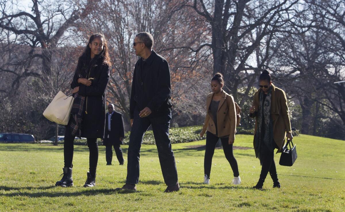 From left, President Obama's daughter Malia, the president, daughter Sasha and First Lady Michelle Obama will visit Yosemite National Park on Friday and Saturday. In this Jan. 3 photo, they returned to the White House after vacationing in Hawaii.