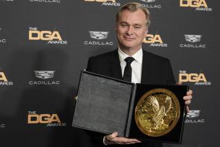 Christopher Nolan, director of the film "Oppenheimer," poses with his DGA Award for Theatrical Feature Film backstage at the 76th DGA Awards, Saturday, Feb. 10, 2024, in Beverly Hills, Calif. (AP Photo/Chris Pizzello)