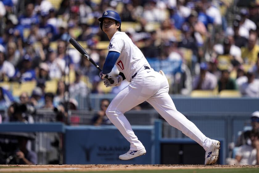 Los Angeles Dodgers' Shohei Ohtani heads to first after hitting a foul ball during the fifth inning of a baseball game against the Cincinnati Reds Sunday, May 19, 2024, in Los Angeles. (AP Photo/Mark J. Terrill)