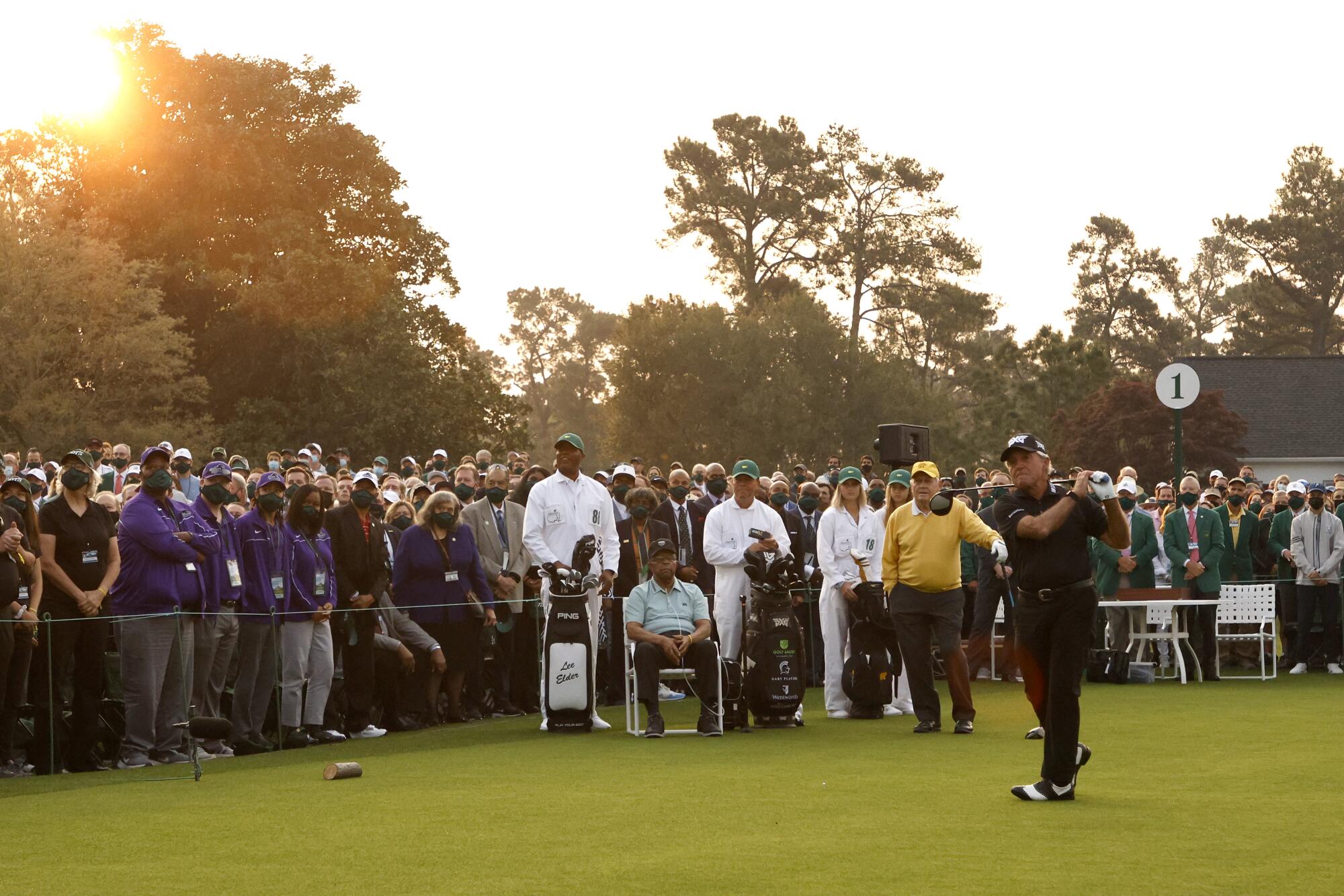 Gary Player follows through on the first tee.