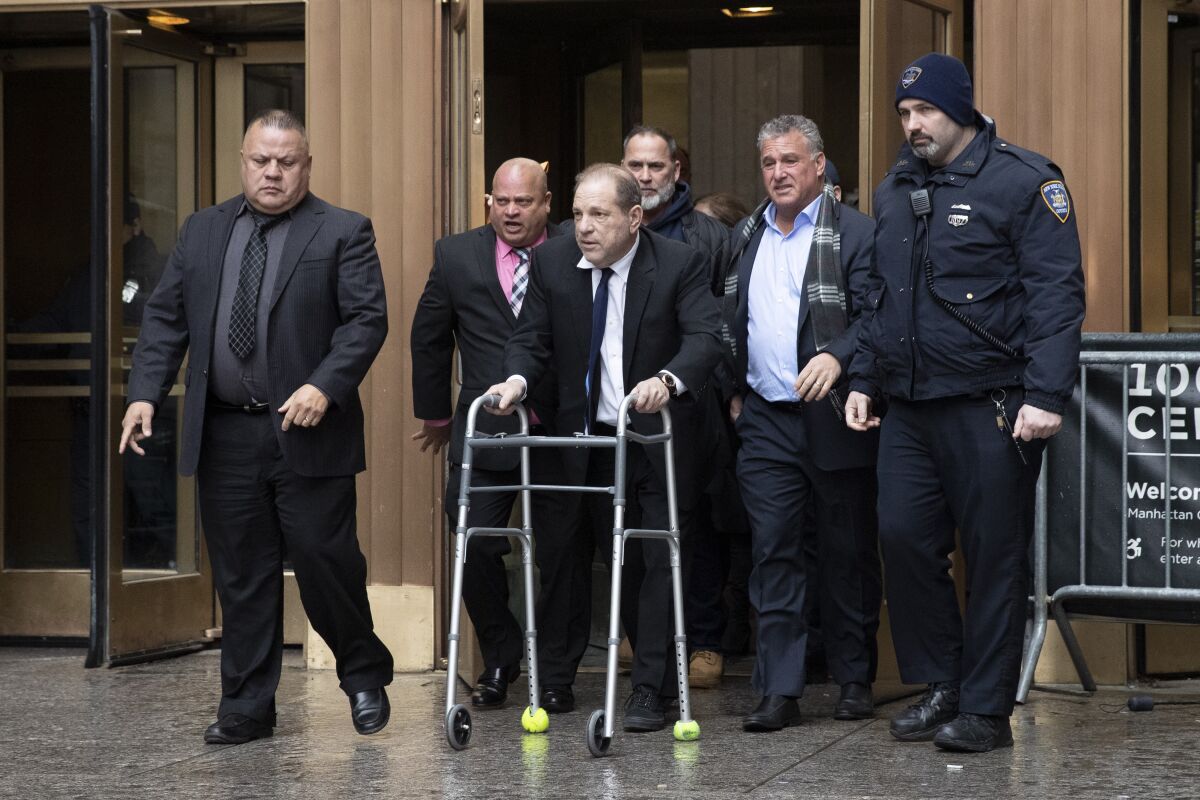 Harvey Weinstein, center, leaves court following a bail hearing Friday in New York.