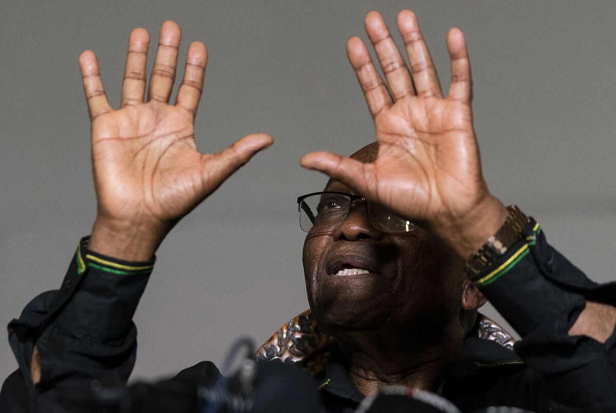 FILE - In this Sunday, July 4 2021, file photo former President Jacob Zuma gestures as he addresses the press at his home in Nkandla, KwaZulu-Natal Province, South Africa. Zuma left his home to hand himself over to authorities to serve a 15-month prison term Wednesday, July 7, 2021. (AP Photo/Shiraaz Mohamed, File)