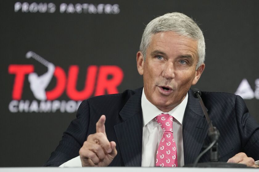 PGA Tour Commissioner Jay Monahan points during a press conference