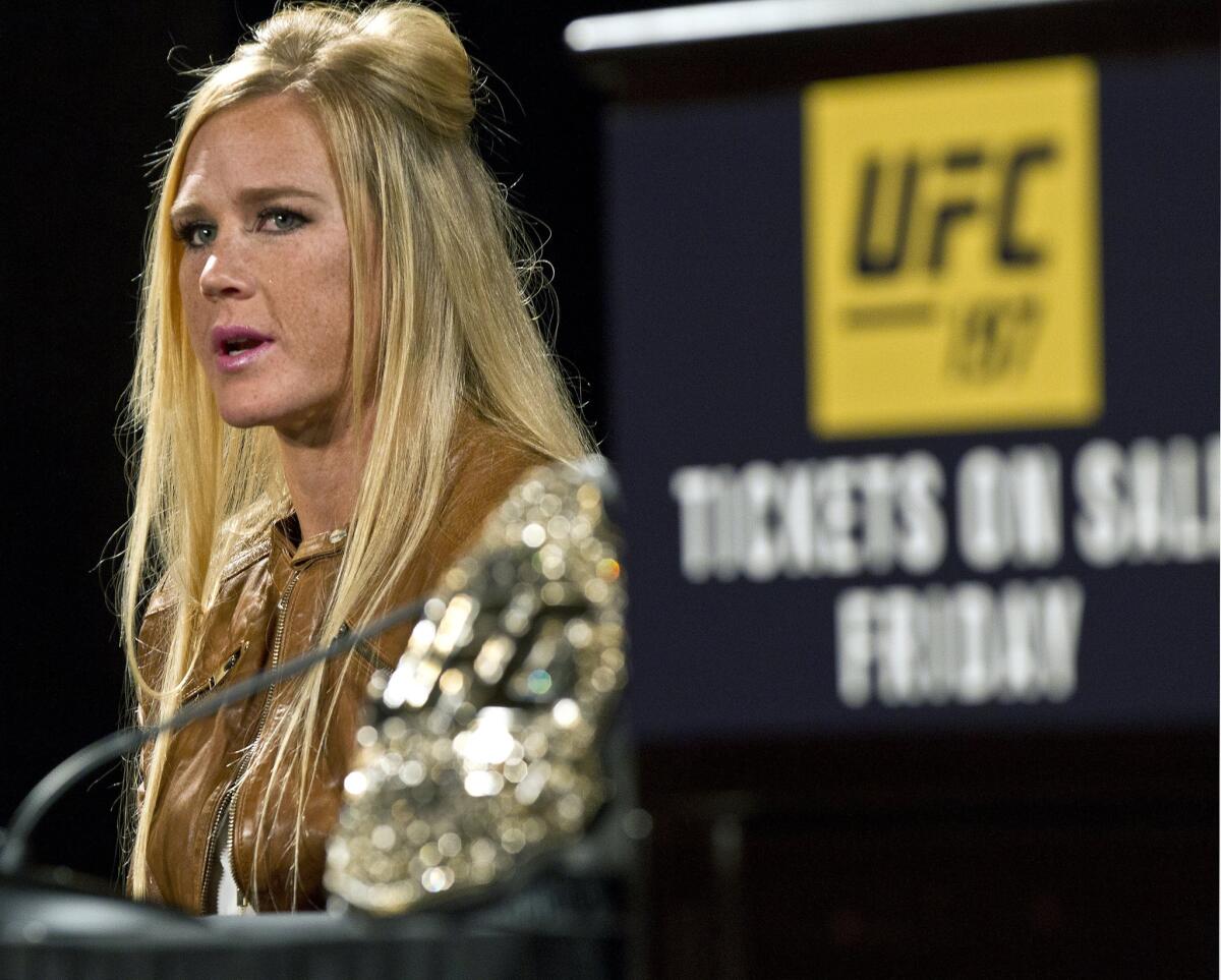 UFC 197 fighter Holly Holm answers a question during a news conference at the MGM Grand in Las Vegas.