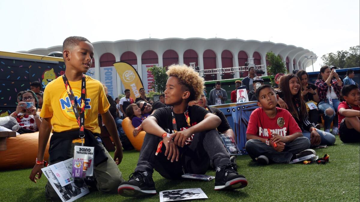 Young fans await a game show at the Fortnite Summer Block Party.