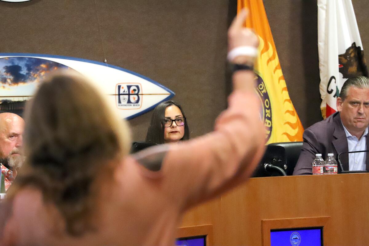 Huntington Beach Mayor Pro Tem Pat Burns, left, Mayor Gracey Van Der Mark and Tony Strickland.