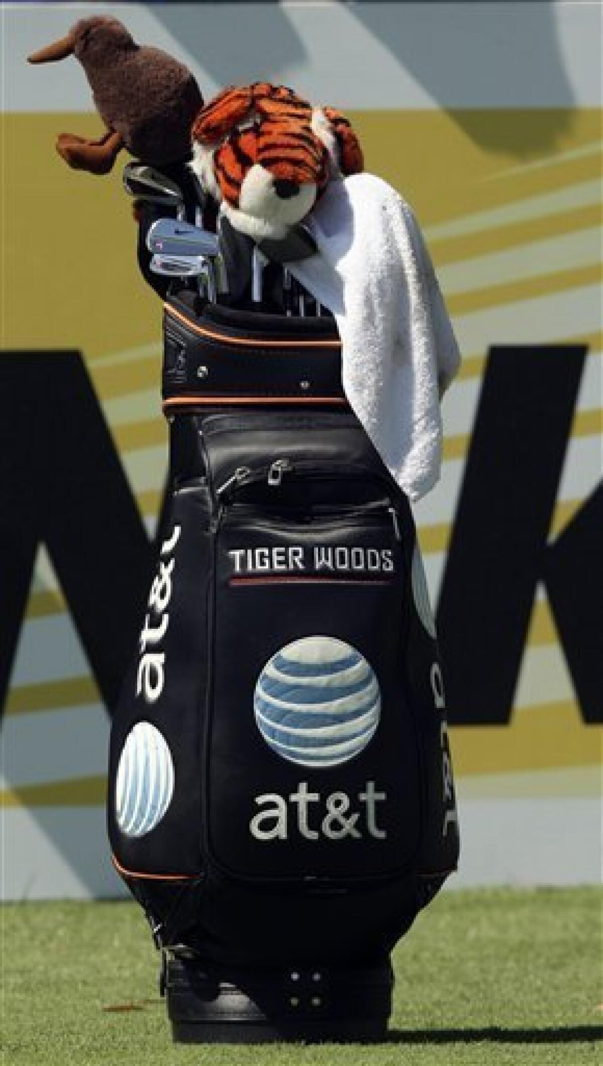 FILE - This Nov. 11, 2009, file photo shows Tiger Woods golf bag on the 18th tee during a Pro-Am match ahead of the Australian Masters golf tournament in Melbourne, Australia. A year has passed since the infamous crash that started it all, and Woods appears ready to re-enter the marketing game. (AP Photo/Rob Griffith, File)