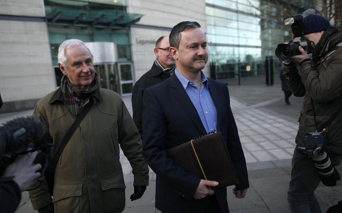 FILE - Gay rights activist Gareth Lee, center, leaves Laganside court, Northern Ireland, Thursday March 26, 2015. A top European court said Thursday, Jan. 6, 2022 that it could not rule in a high-profile gay rights discrimination case centered on a request to decorate a cake with the words “Support Gay Marriage.” The Strasbourg-based European Court of Human Rights said the case was inadmissible because gay rights activist Gareth Lee had failed to “exhaust domestic remedies” in his case. (AP Photo/Peter Morrison, File)