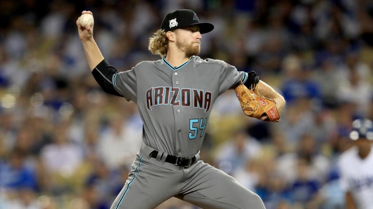 Arizona Diamondbacks' Jimmie Sherfy pitches in the eighth inning of Game One against the Los Angeles Dodgers.