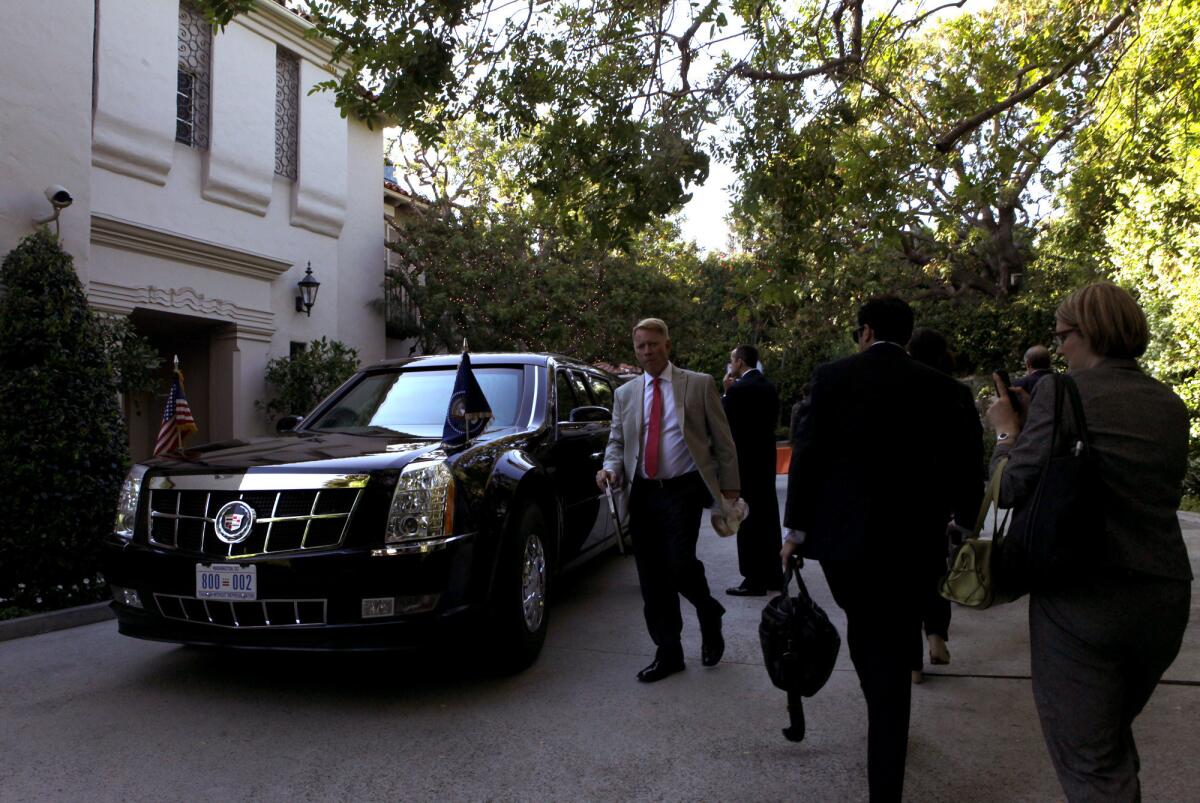 President Obama's car in front of the Bel-Air home of Alan and Cindy Horn.