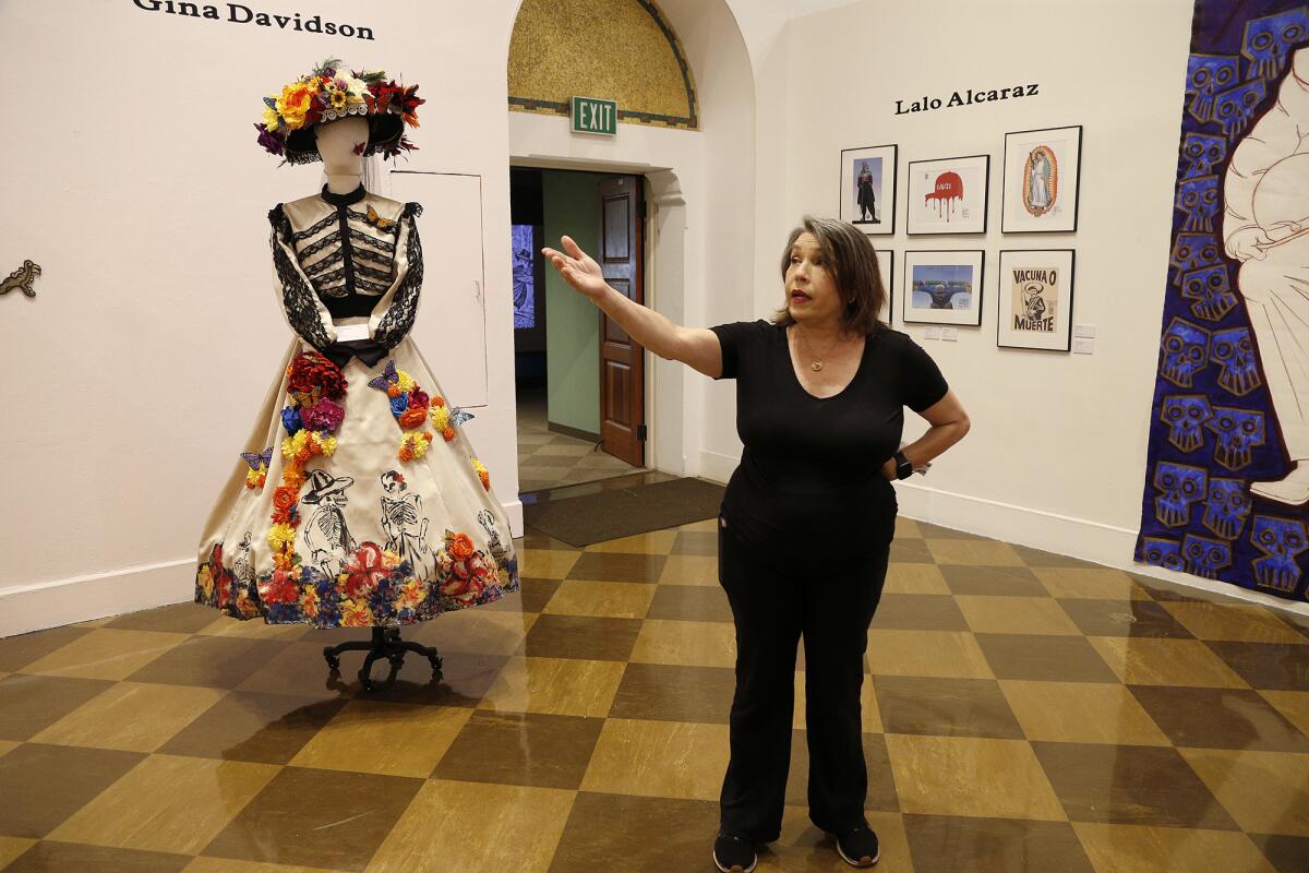 Guest curator Consuelo G. Flores gives a tour of the art exhibit at Fullerton Museum.