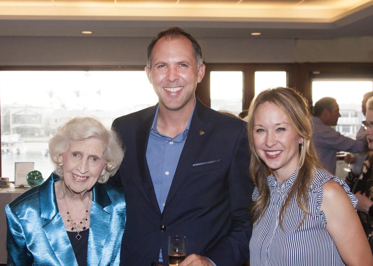 Sharon McNalley, Tommy and Julie Phillips, major sponsors of Hutchins Consort attend recent dinner fundraiser.
