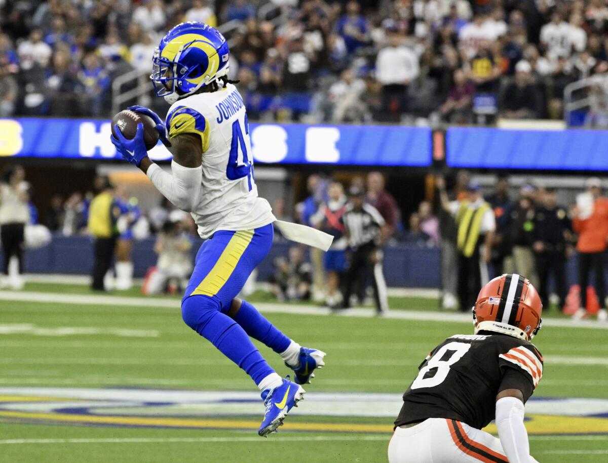 Rams safety John Johnson III  intercepts a pass intended for Browns wide receiver Elijah Moore.