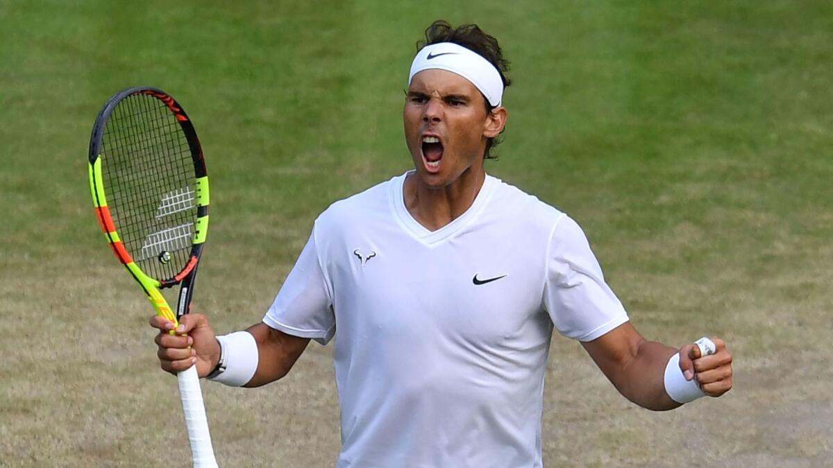 Rafael Nadal celebrates after defeating Sam Querrey during their singles quarterfinal match at Wimbledon on Wednesday. Nadal will play Roger Federer in the semifinals.