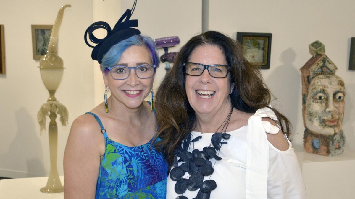 Co-hosting last week's opening night reception were the gallery's director Virginia Causton-Keene, left, and exhibit coordinator Caroline Blackburn.