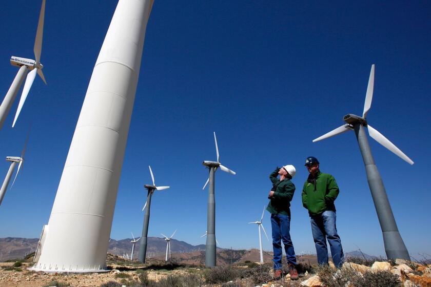 TEHACHAPI, CA - MAY 23, 2013: Kevin Martin, left, and Randy Hoyle of Terra-Gen Power among wind turbines at Alta East wind energy project in the Tehachapi Mountains. (Irfan Khan / Los Angeles Times)