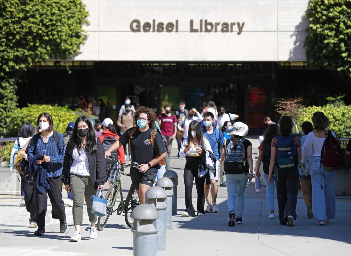 UC San Diego students walk near Geisel Library in September.