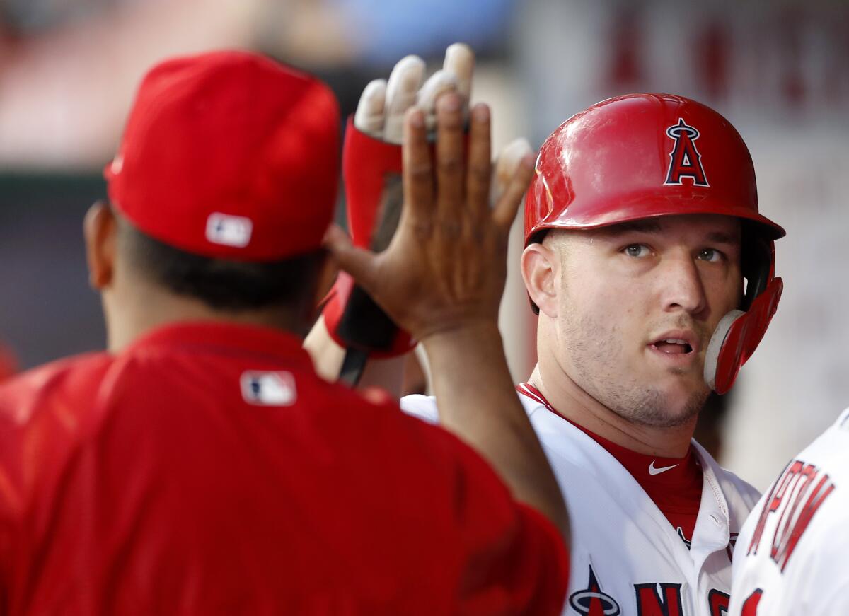 Mike Trout accompanied the Angels on their road trip as he continues to rehab a calf strain. (Luis Sinco/Los Angeles Times)