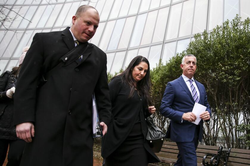 BOSTON, MA - MARCH 29: Marjorie Klapper, 50, of Menlo Park, California, center, leaves the John Joseph Moakley United States Courthouse in Boston on March 29, 2019. More defendants in the nationwide college admissions cheating scandal made their initial appearances in federal court in Boston on Friday to face charges stemming from the case that exploded into the headlines earlier this month. The suspects are among 50 defendants charged in the breathtaking scheme, in which wealthy parents allegedly cut fat checks to admitted ringleader William Rick Singer to have their children falsely certified as athletic recruits at fancy colleges, or to facilitate cheating on SAT and ACT exams. (Photo by Nathan Klima for The Boston Globe via Getty Images)