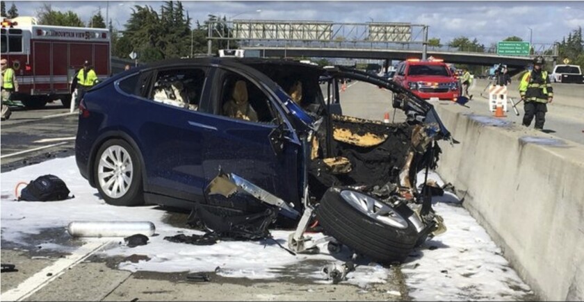 A Tesla electric vehicle that crashed into a freeway barrier in Mountain View, Calif. 