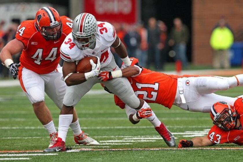 Ohio State running back Carlos Hyde (34) ran through, over and around the Illinois defense for 246 yards on Saturday.