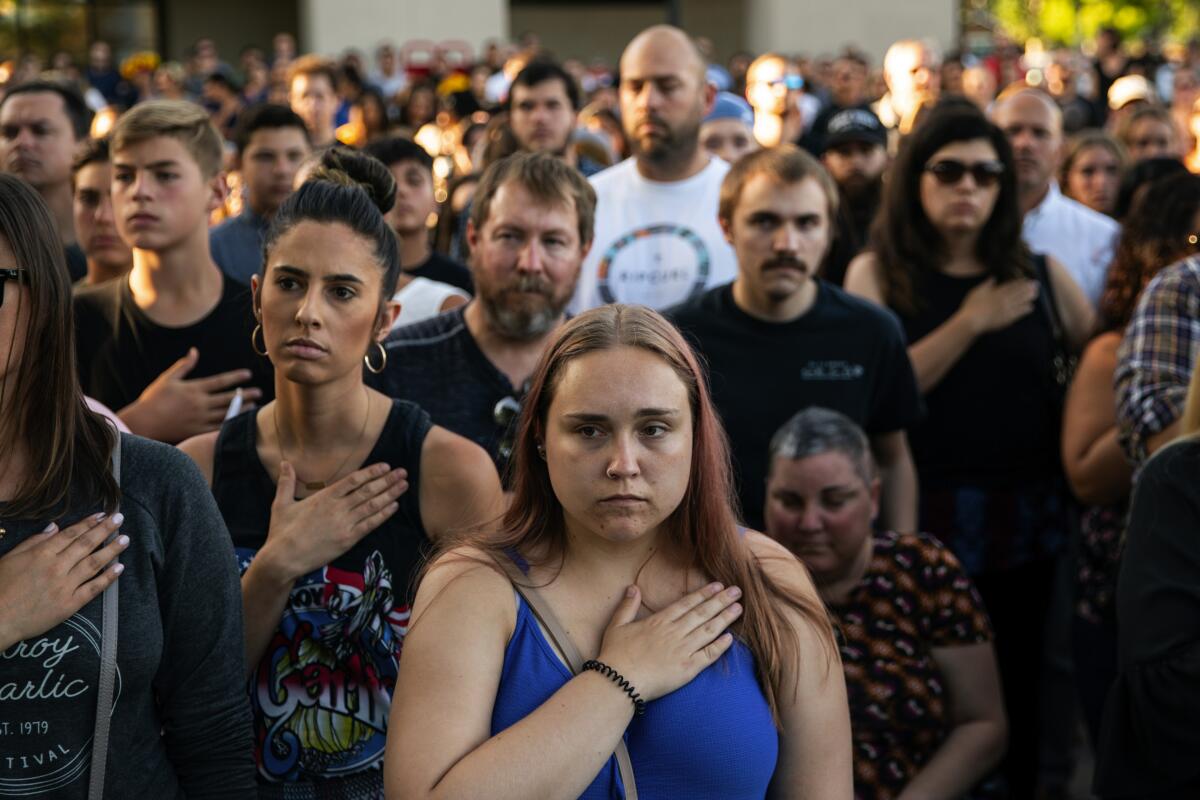 Residents attend a vigil for three people who were killed in a shooting at the Gilroy Garlic Festival in Northern California in July.