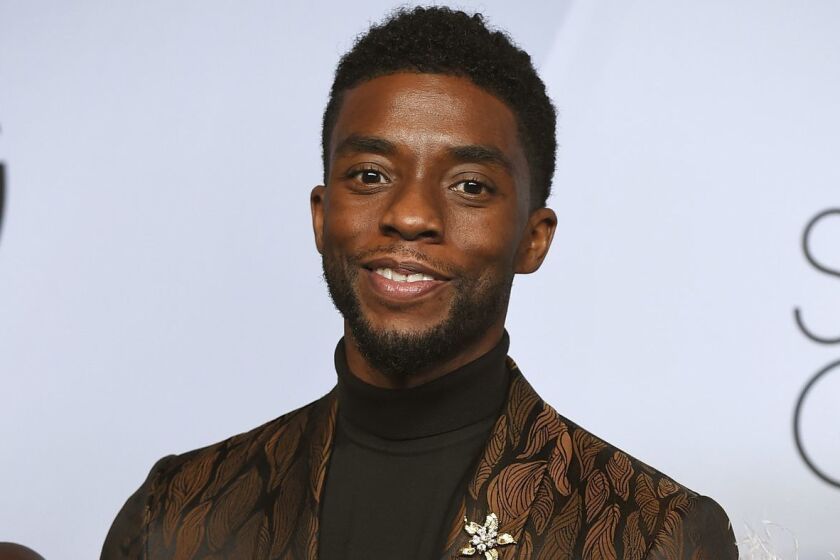 Chadwick Boseman poses with the award for outstanding performance by a cast in a motion picture for "Black Panther" in the press room at the 25th annual Screen Actors Guild Awards at the Shrine Auditorium & Expo Hall on Sunday, Jan. 27, 2019, in Los Angeles. (Photo by Jordan Strauss/Invision/AP)