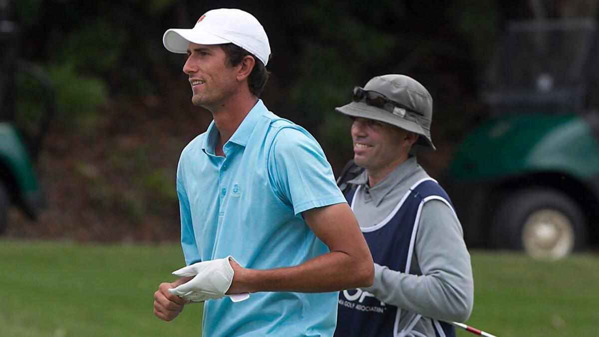 Stewart Hagestad walks down the fairway with his caddie during the 2017 U.S. Open Sectional Qualifying at Big Canyon Country Club on Monday.