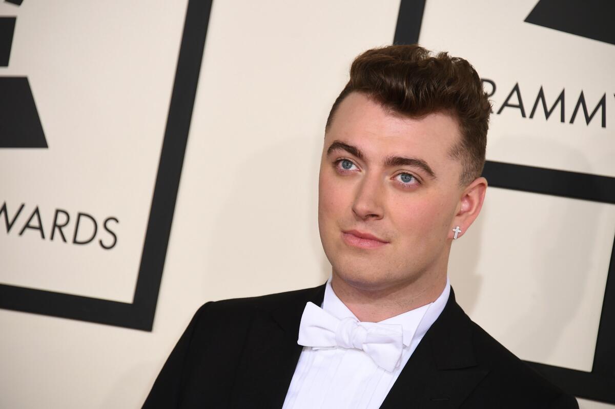 Nominee Sam Smith wears a white bowtie at the Grammys.