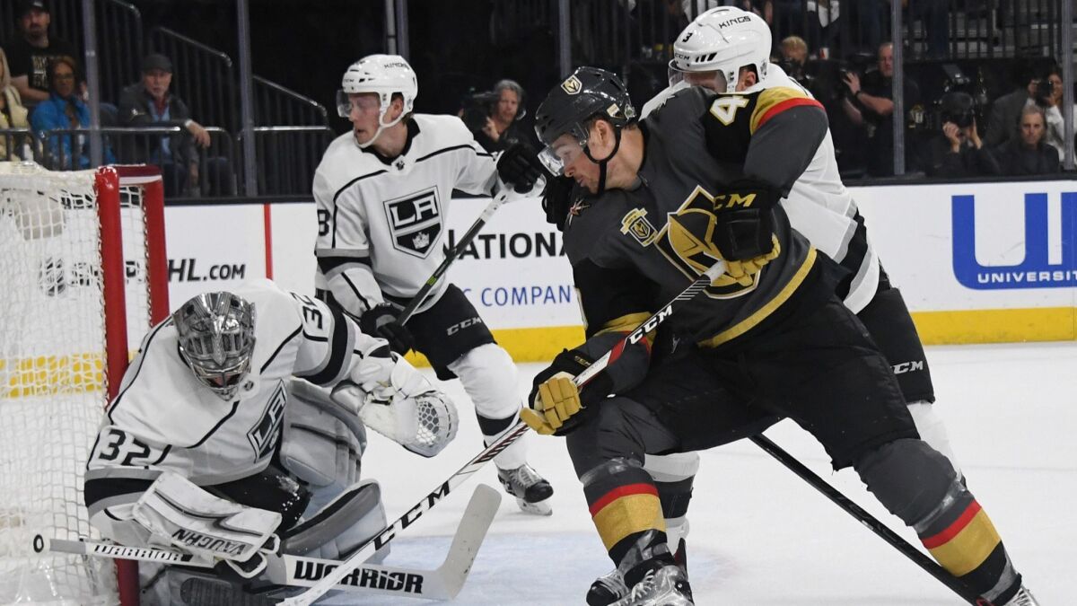 Kings' Jonathan Quick (32) blocks a shot by Vegas Golden Knights' Ryan Carpenter (40) in the second period of Game One of the Western Conference First Round on Wednesday.