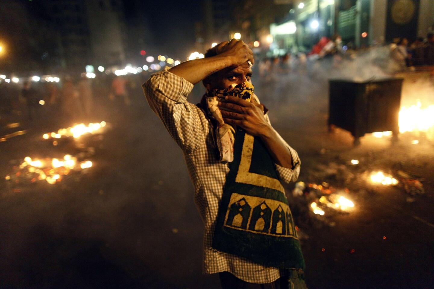 July 16: Protester amid smoke in Cairo