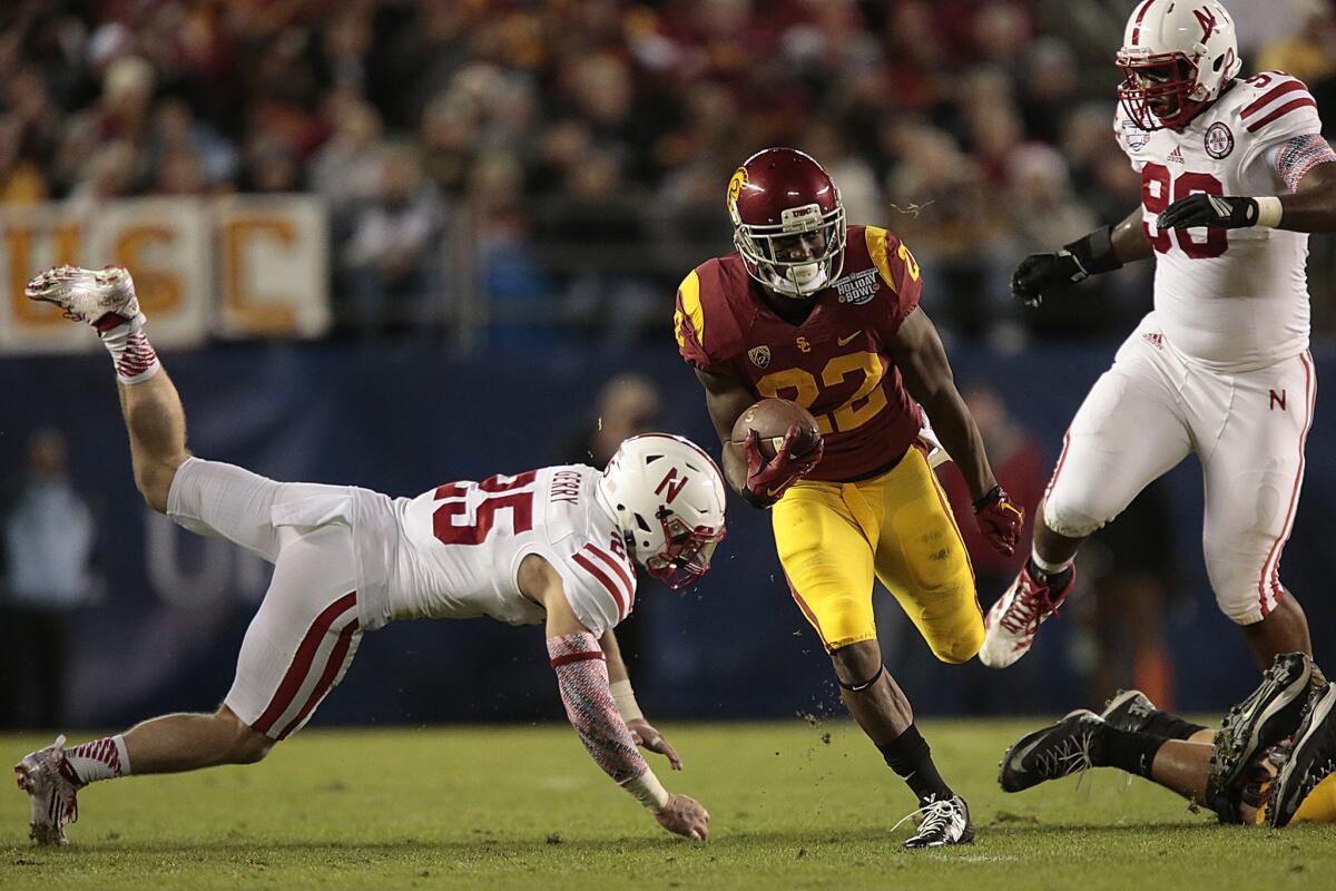 Trojans running back Justin Davis makes a long run during USC's 45-42 victory over Nebraska in the Holiday Bowl last month.