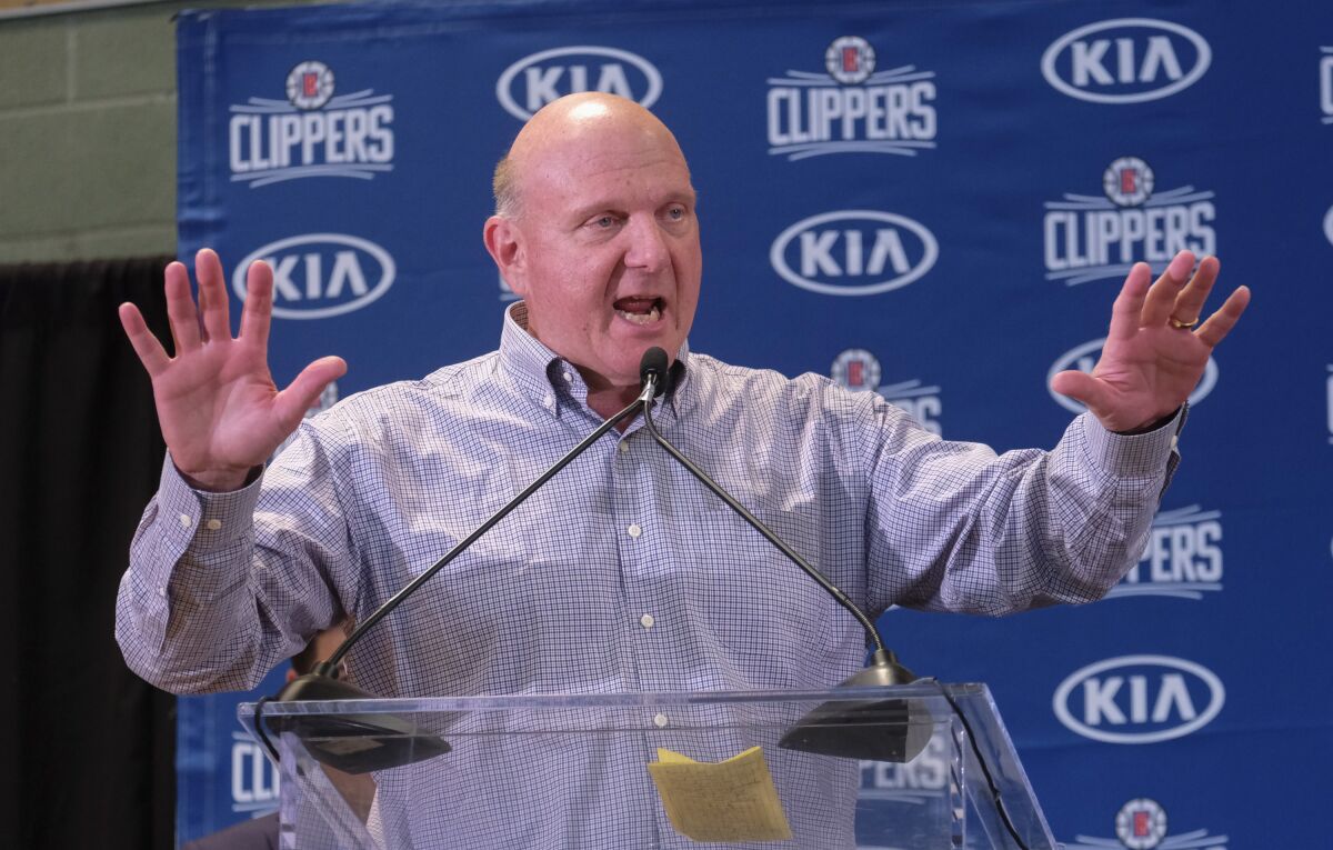 Clippers chairman Steve Ballmer introduces Paul George and Kawhi Leonard at a news conference at the Green Meadows Recreation Center on Wednesday.