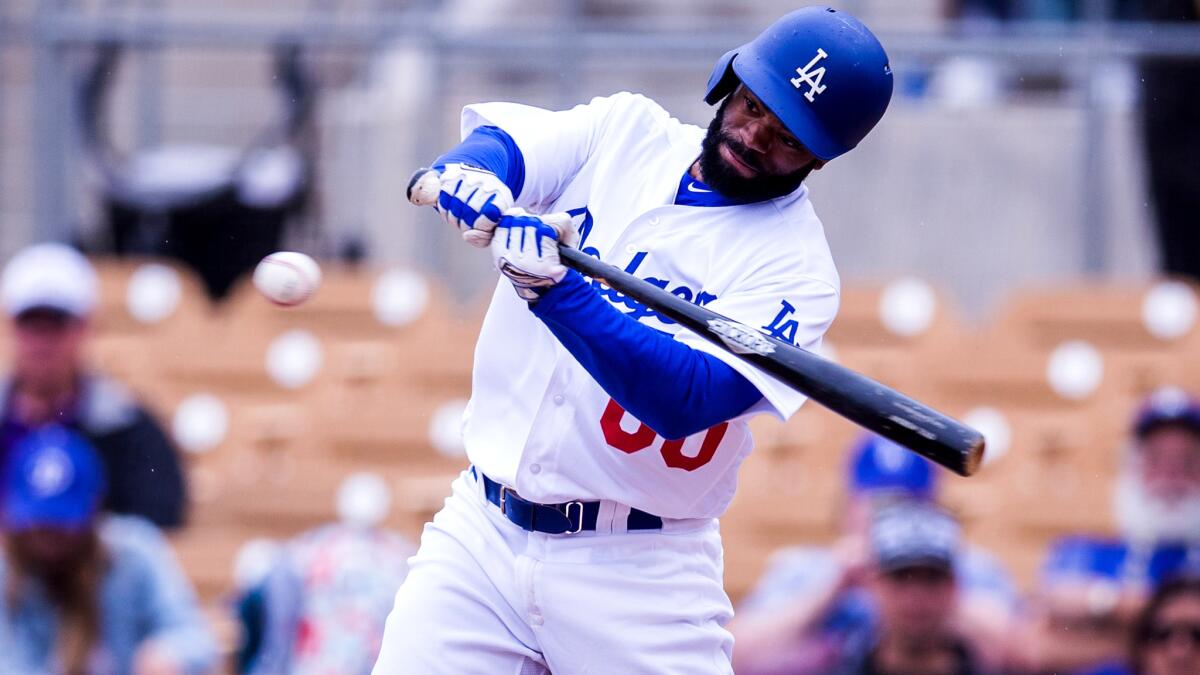 Andrew Toles, shown during a Dodgers spring game in February, hit a grand slam against the A's on Saturday. (Rob Tringali / Getty Images)