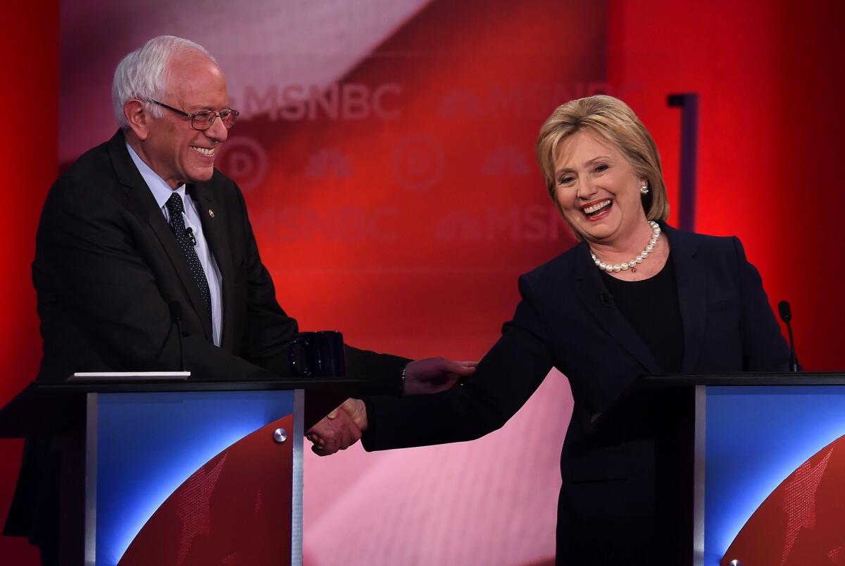Democratic presidential candidates Bernie Sanders and Hillary Clinton during a debate Thursday at the University of New Hampshire in Durham.