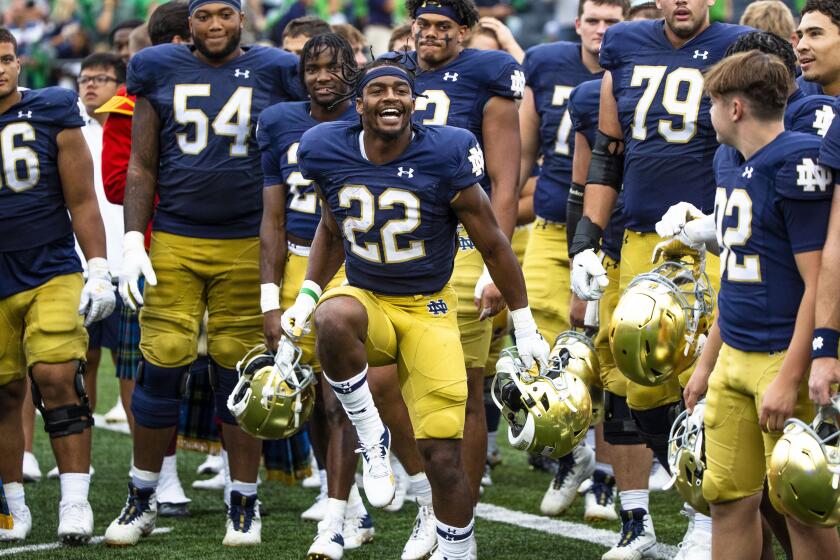 Notre Dame's Devyn Ford (22) dances in front of his teammates after an NCAA college football game against Central Michigan on Saturday, Sept. 16, 2023, in South Bend, Ind. (AP Photo/Michael Caterina)