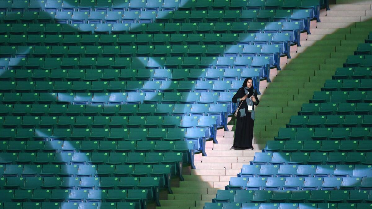 A Saudi woman arrives at a stadium to attend an event in the capital Riyadh on Sept. 23, 2017, commemorating the anniversary of the founding of the kingdom.