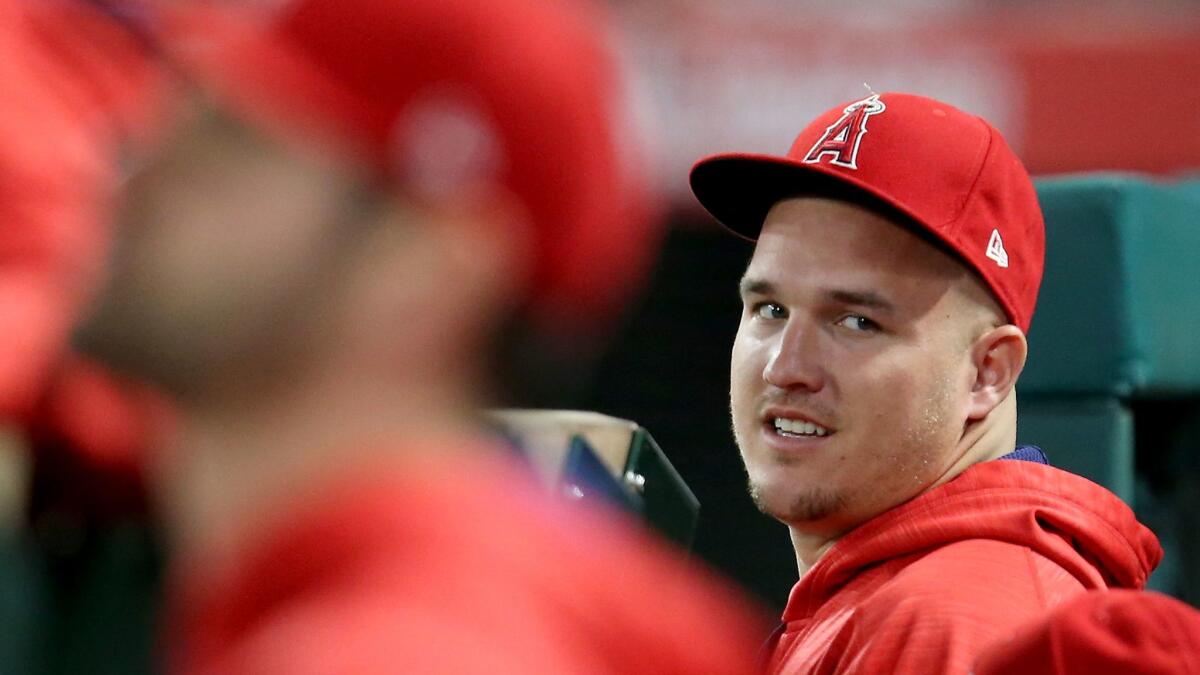 Injured Angels outfielder Mike Trout watches his team play the Dodgers on June 28.