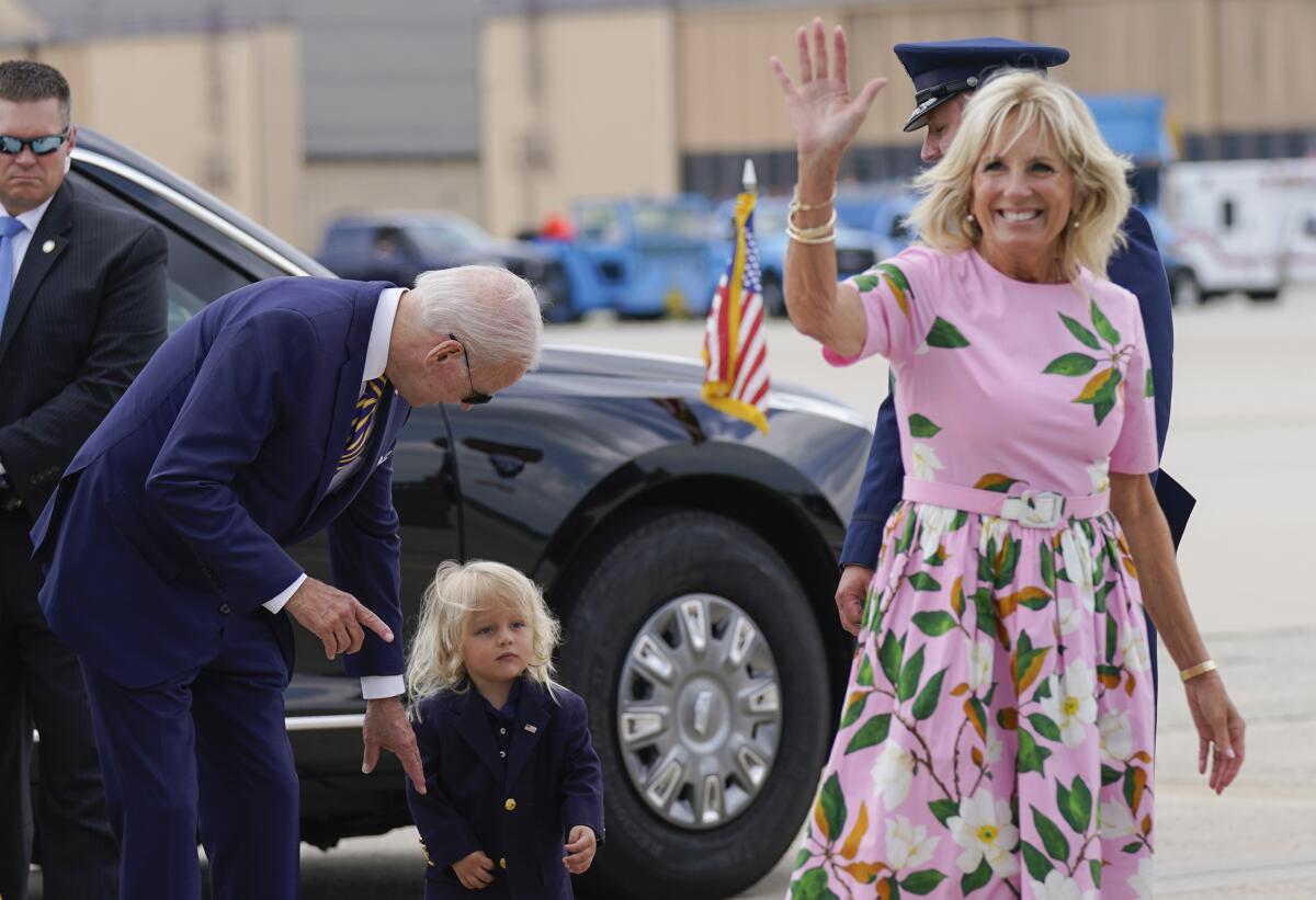 FILE - President Joe Biden looks at his grandson Beau Biden as first lady Jill Biden waves and walks to board Air Force One 