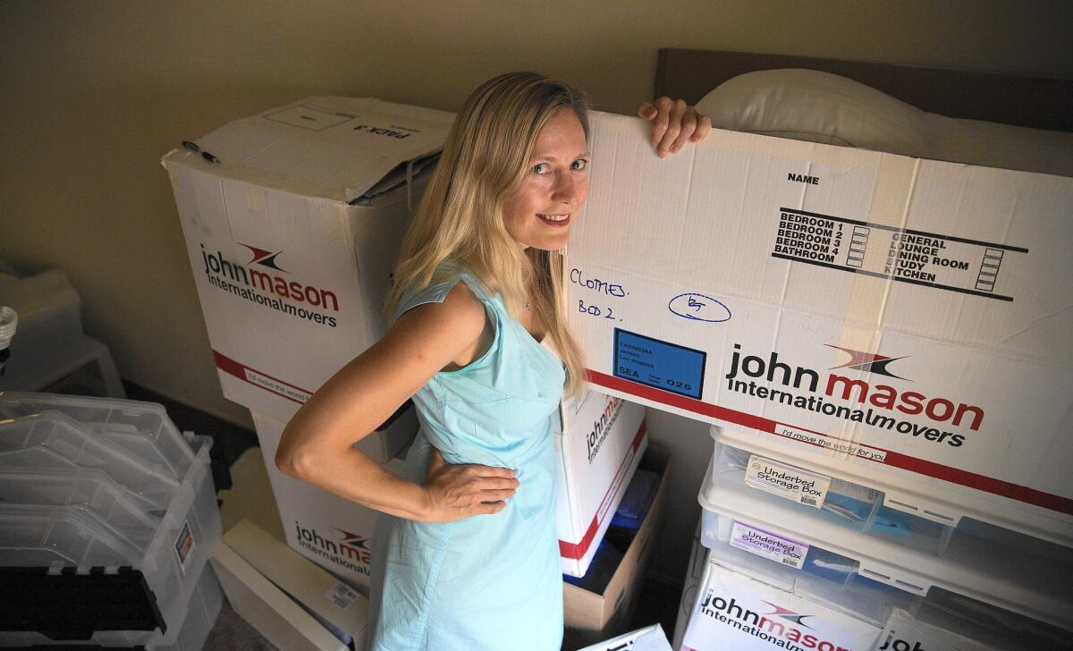 Rose-Linn Jensen, who recently moved from London to Sherman Oaks, is living in an apartment but is not unpacking because she is looking to purchase a home now, before interest rates rise.