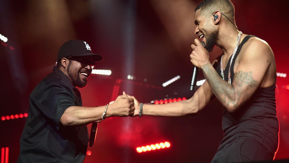 Usher brings Ice Cube to the stage at Staples Center.