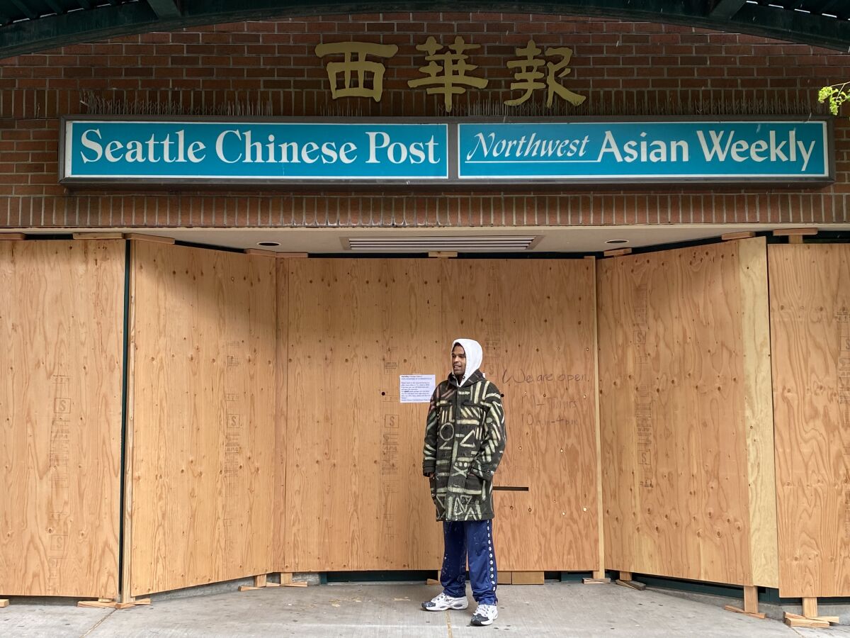 Procter may paint plywood covering Chinatown newspaper offices next.